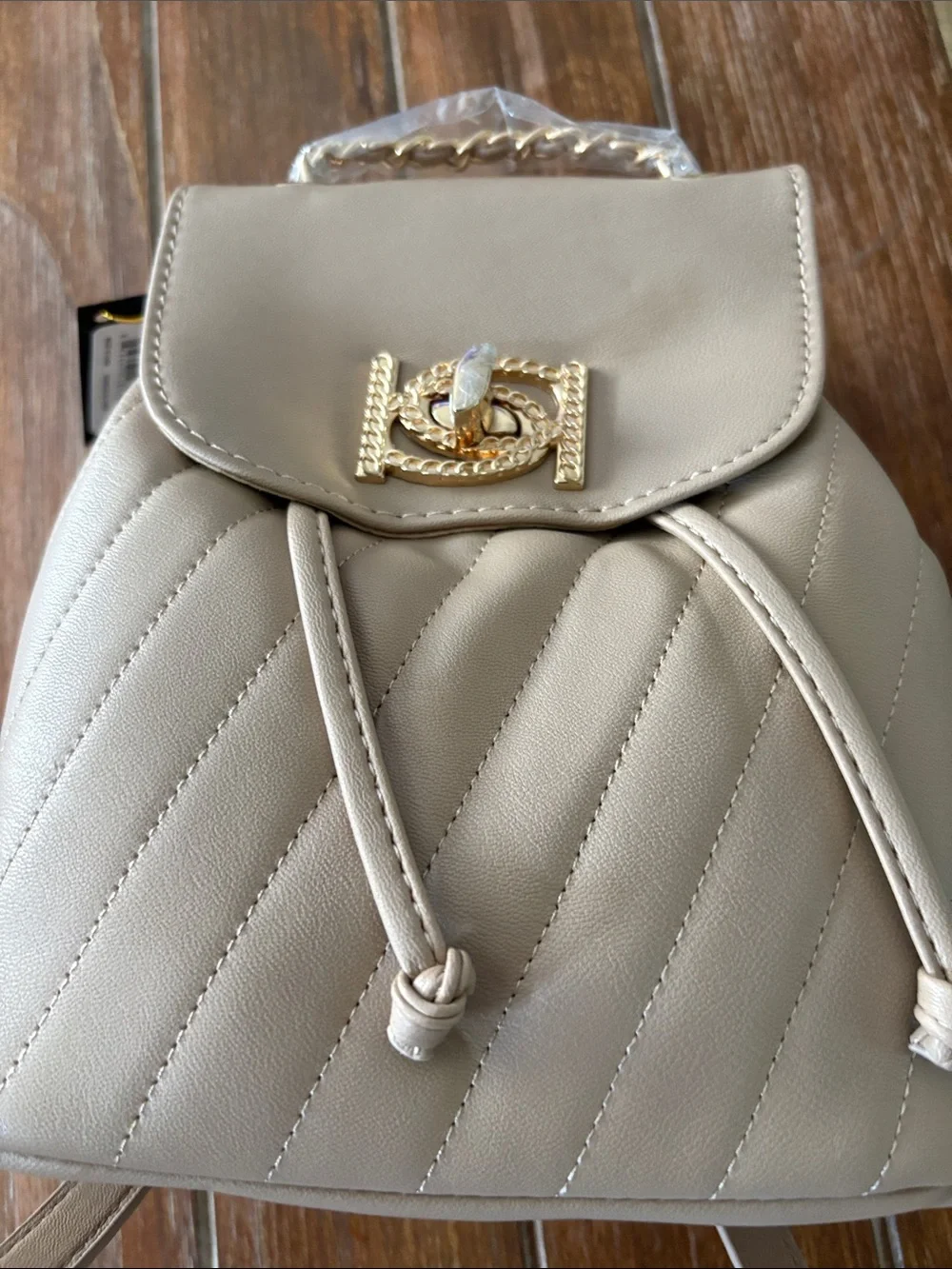 bebe Quilted Cream Drawstring Backpack with Gold-Tone Accent